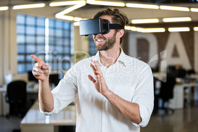 Businessman gesturing while using virtual reality simulator