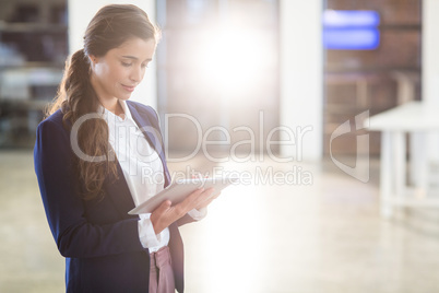 Woman using digital tablet