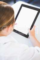 Schoolkid using digital tablet in classroom
