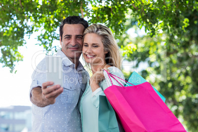 Couple smiling while taking selfie