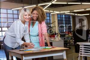 Female coworkers working at desk