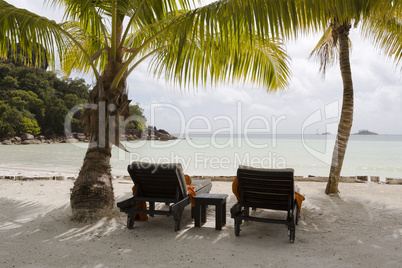 Deckchairs at tropical landscape view, Seychelles