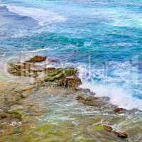 background of ocean waters and coastal stones