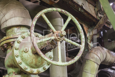 Industrial valve in an abandoned factory.