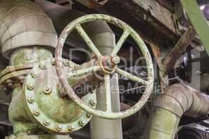 Industrial valve in an abandoned factory.