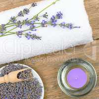 lavender flowers, scented candles and towels