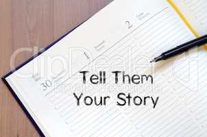 Tell them your story write on notebook