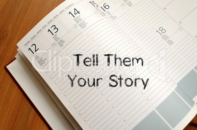 Tell them your story write on notebook