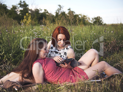 Two young girls on a rest outdoors
