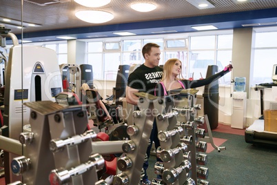 Cute girl doing selfie with her fitness instructor