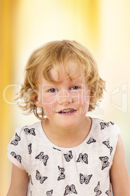 Portrait of a girl with blond hair and blue eyes