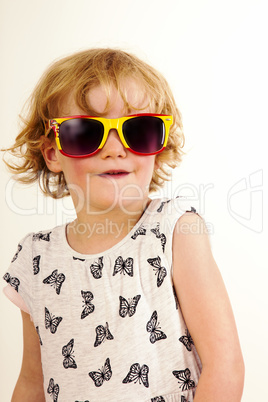 Portrait of a girl with blond hair and sunglasses