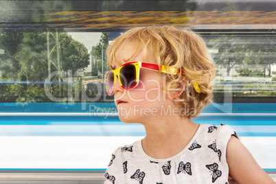 Portrait of a girl with blond hair and sunglasses