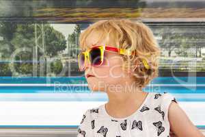 Portrait of a girl with blond hair and sunglasses
