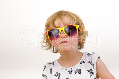 Portrait of a girl with blond hair and sunglasses