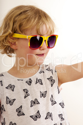 Portrait of a girl with blond hair and sunglasses