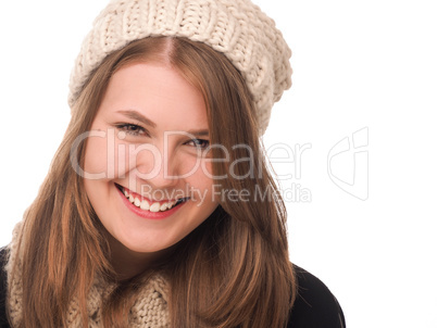 Happy young woman wih wool cap an d scarf