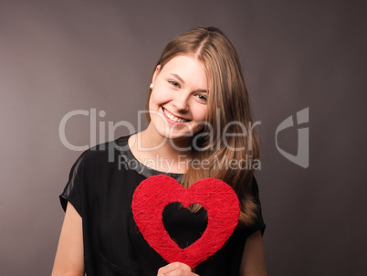 Young woman with ared heart