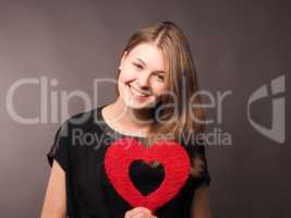 Young woman with ared heart