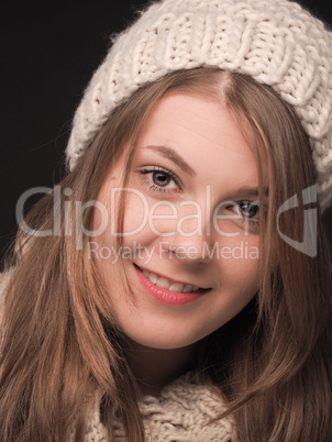 Young woman with wool cap and scarf