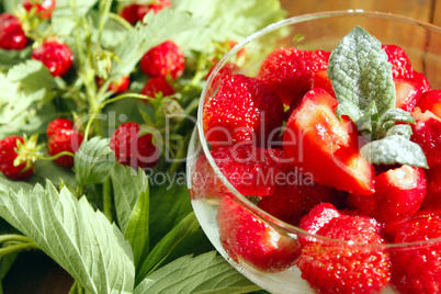strawberries in a bowl and strawberries bunches