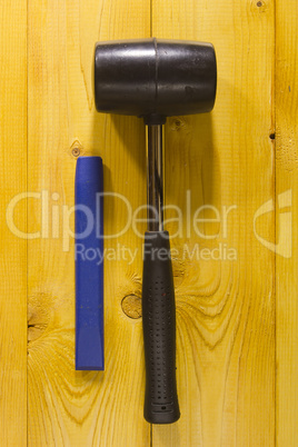Chisel and black rubber hammer