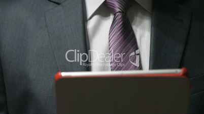 Businessman looks for text using a computer