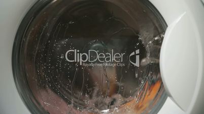 Internal view of washing machine drum during wash