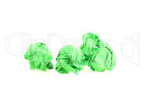 Zerknüllte grüne Papierkugeln