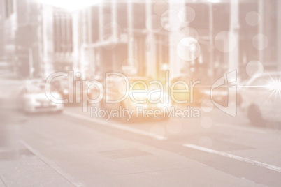 City street with cars and bright light and lensflares
