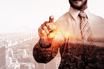 Composite image of businessman in shirt pointing with his finger