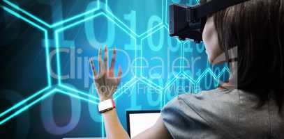 Composite image of woman using a virtual reality device