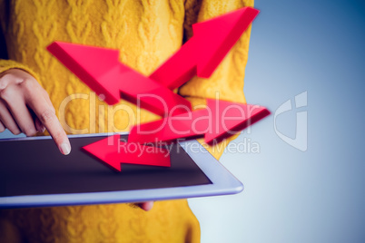 Composite image of focused asian woman using tablet