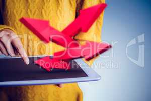 Composite image of focused asian woman using tablet