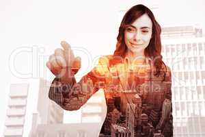 Composite image of portrait of businesswoman touching invisible