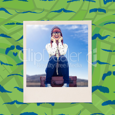 Composite image of smiling hipster woman sitting on suitcase