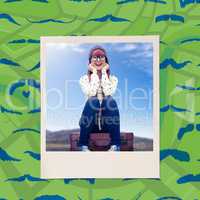 Composite image of smiling hipster woman sitting on suitcase
