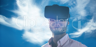 Composite image of portrait of businessman holding virtual glass