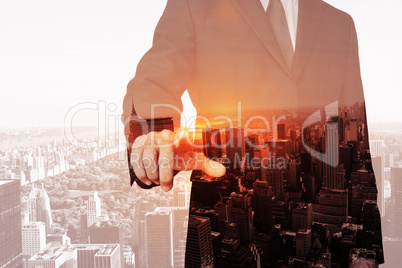 Composite image of businessman pointing