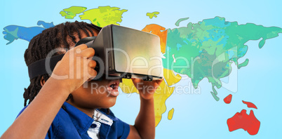 Composite image of profile view of little boy holding virtual gl