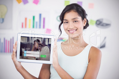 Composite image of happy businesswoman showing digital tablet in