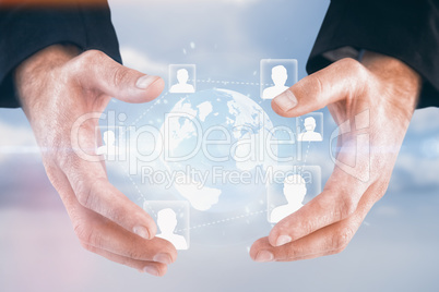 Composite image of businessman holding hand out in presentation