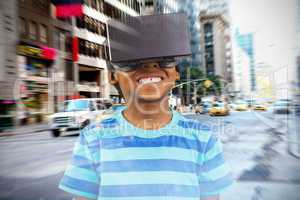 Composite image of boy using a virtual reality device