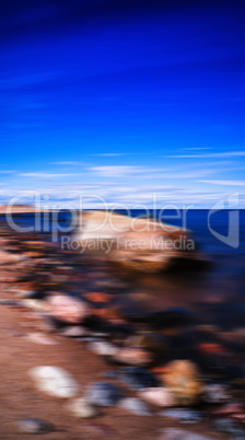 Vertical vivid stony beach motion blurred abstraction background