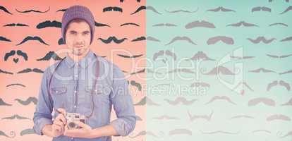Composite image of portrait of confident  hipster using camera