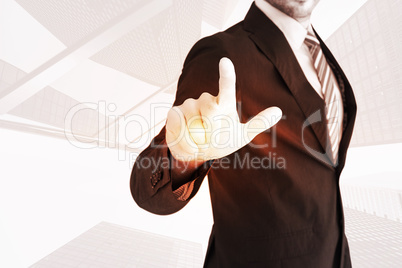 Composite image of businessman pointing with his finger