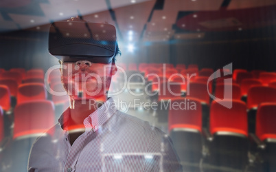 Composite image of businessman using an oculus