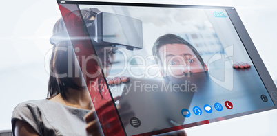 Composite image of nervous businessman peeking over desk