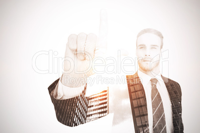 Unsmiling businessman in suit pointing up his finger