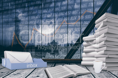 Composite image of an inbox beside books